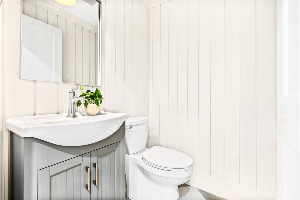 12 Prospect Street, Unit 1 Boston, MA 02129 - Photo 15 of 20 a bathroom with a sink a toilet and vanity