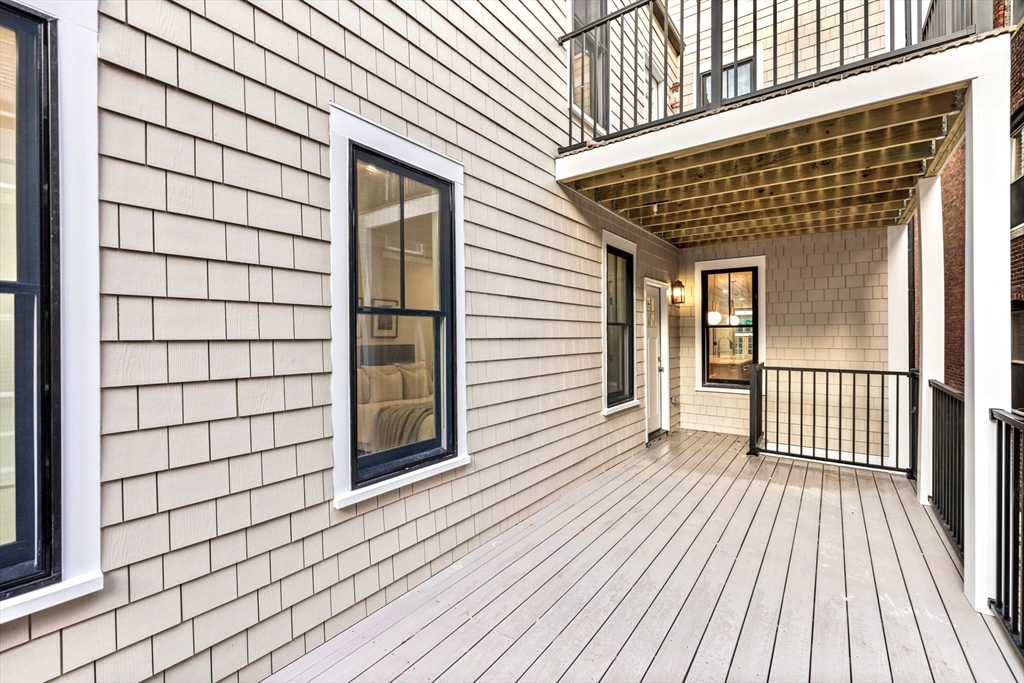 12 Prospect Street, Unit 1 Boston, MA 02129 - Photo 17 of 20 a view of a wooden deck