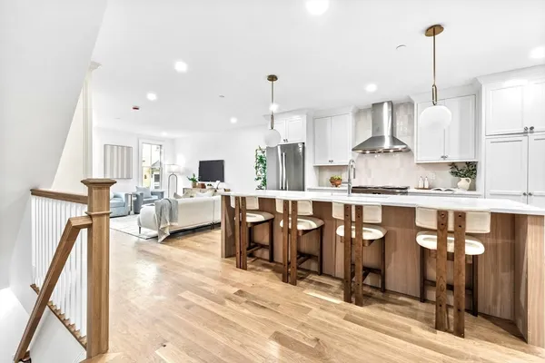 a kitchen with cabinets and stainless steel appliances