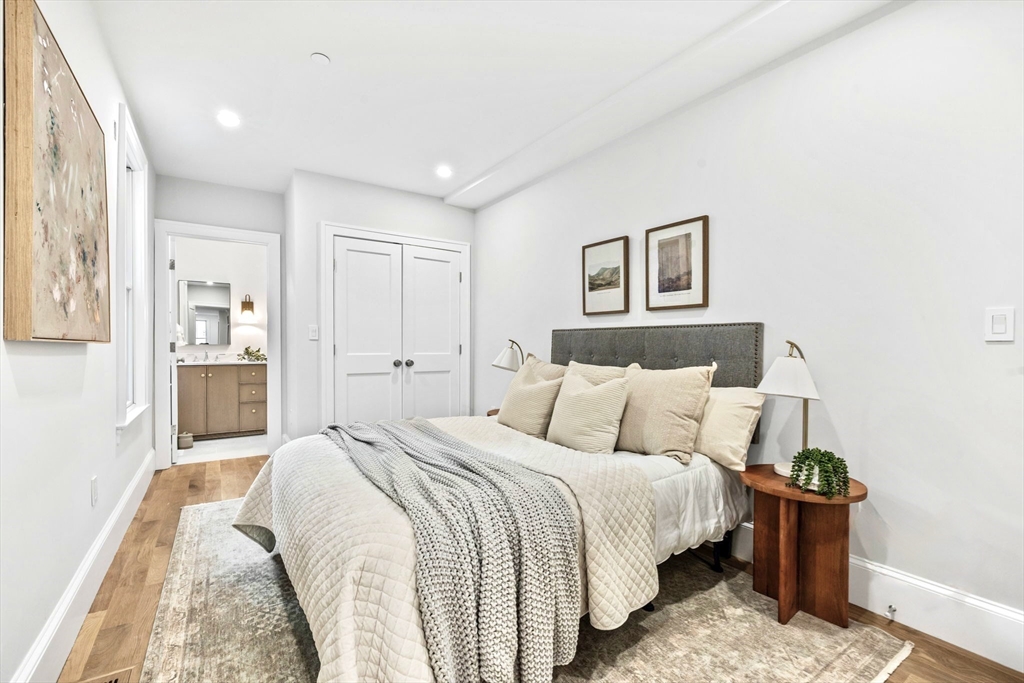 12 Prospect Street, Unit 1 Boston, MA 02129 - Photo 9 of 20 a bed room with a bed and a painting