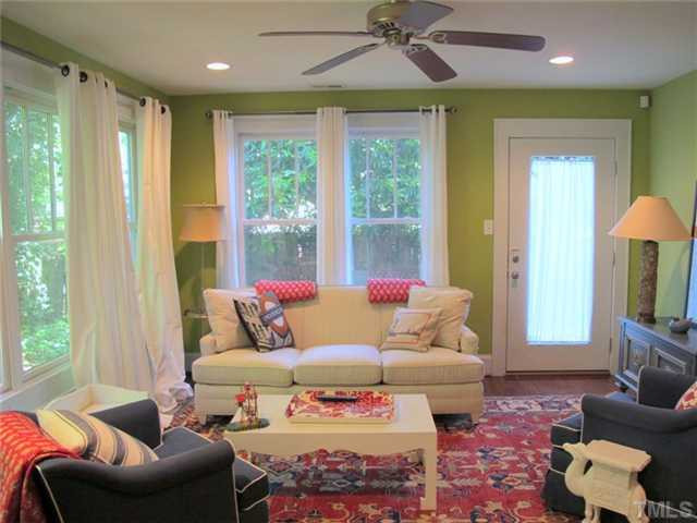 2208 Creston Road Raleigh, NC 27608 - Photo 16 of 23 a living room with furniture and a large window