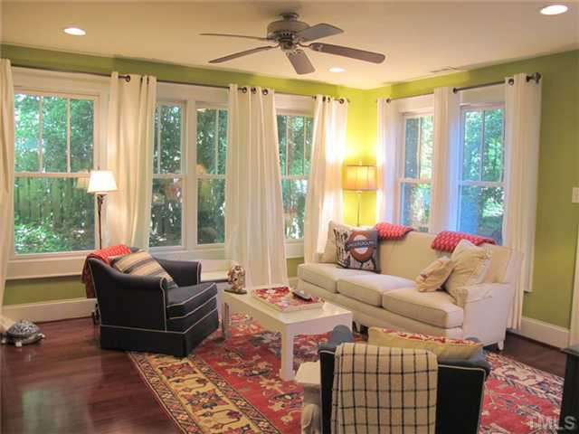 2208 Creston Road Raleigh, NC 27608 - Photo 17 of 23 a living room with furniture and large windows