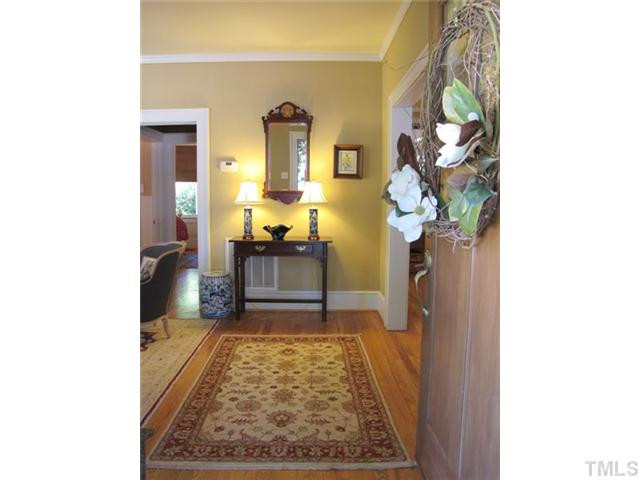 2208 Creston Road Raleigh, NC 27608 - Photo 5 of 23 a bathroom with a sink and a mirror