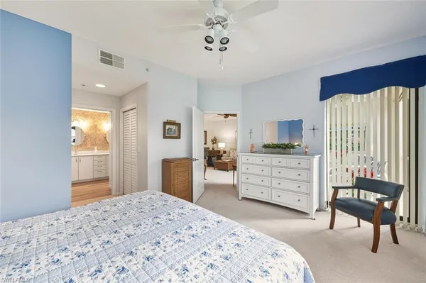 a bedroom with a bed and furniture