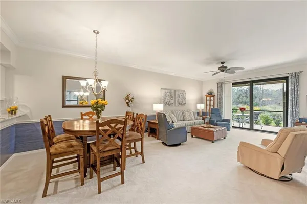 a view of a livingroom with furniture and chandelier