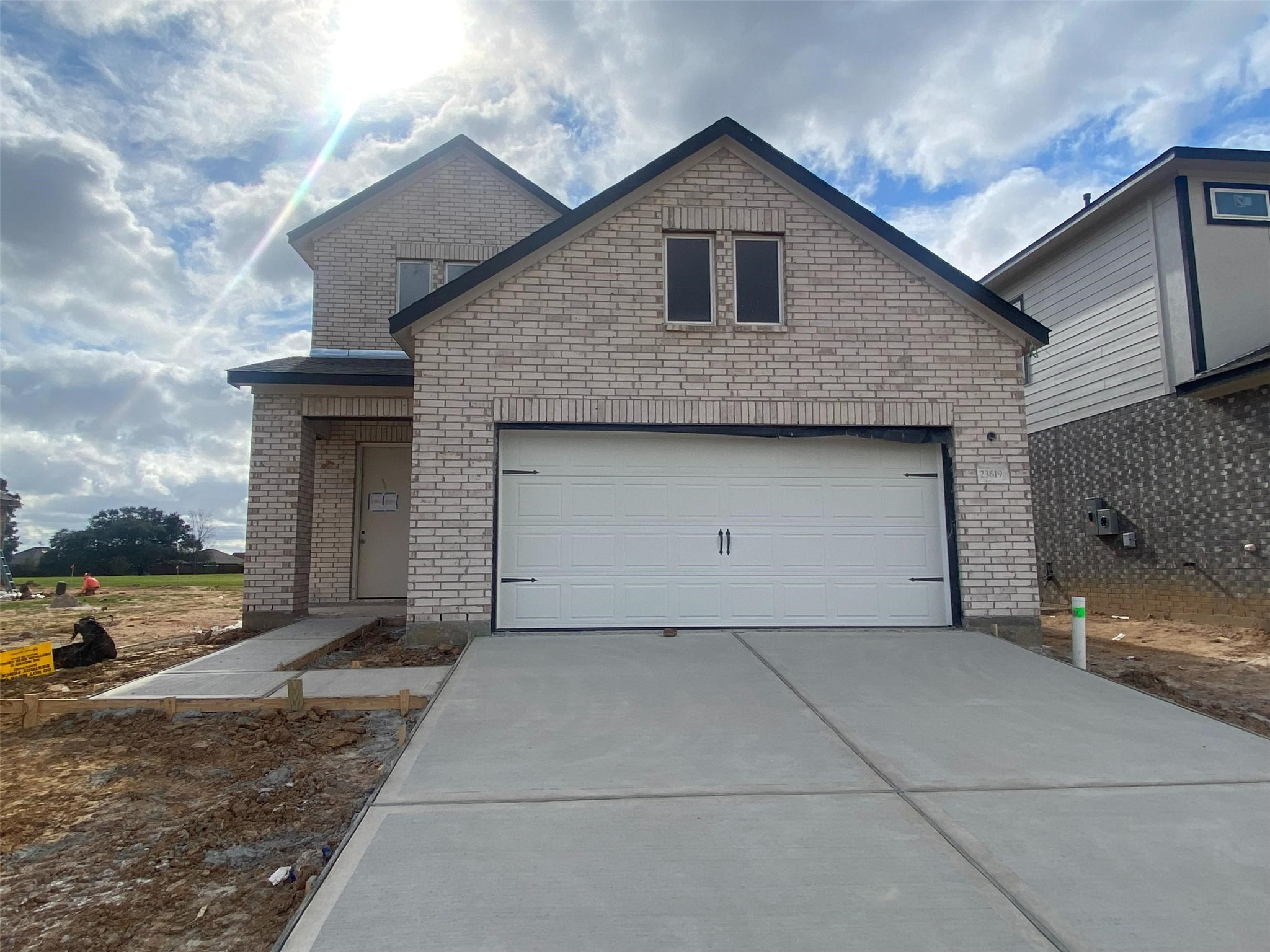 a front view of a house with yard