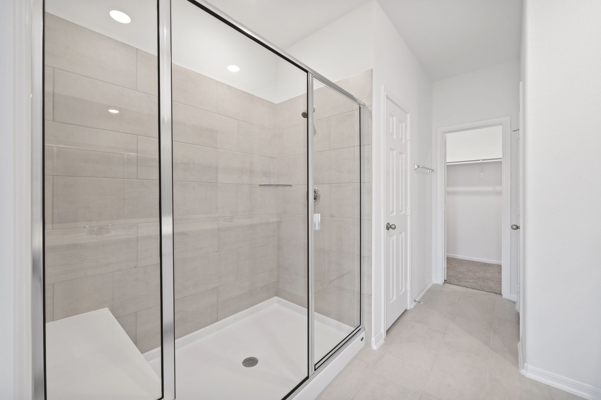 23619 Cinnamon Tree Lane Katy, TX 77493 - Photo 13 of 33 a bathroom with a glass shower door