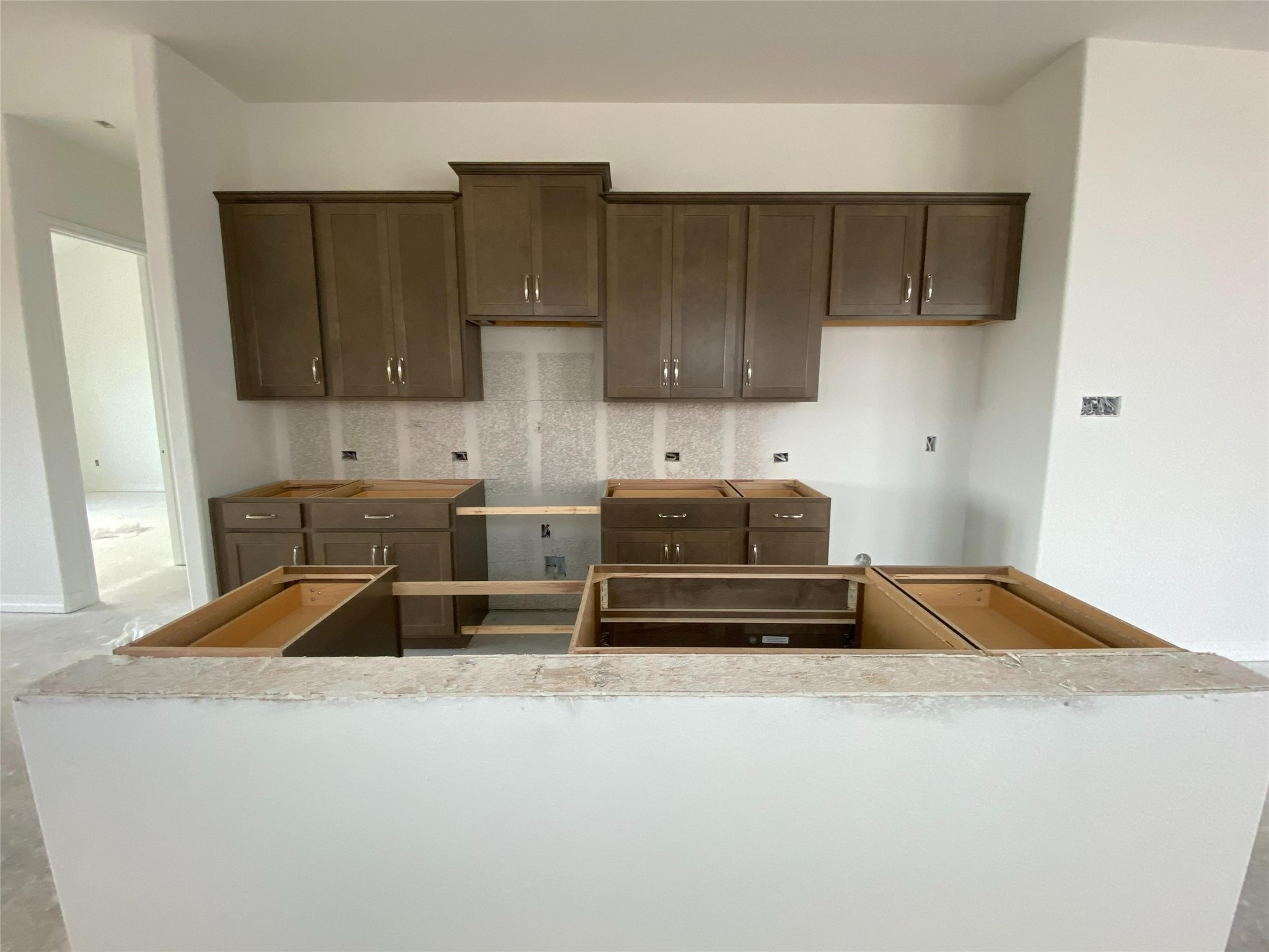 23619 Cinnamon Tree Lane Katy, TX 77493 - Photo 21 of 33 a kitchen with kitchen island a sink and cabinets