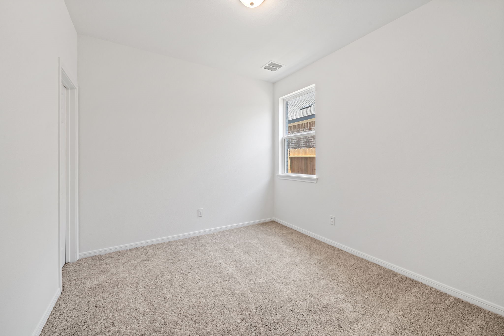 23619 Cinnamon Tree Lane Katy, TX 77493 - Photo 5 of 33 a view of an empty room with a window