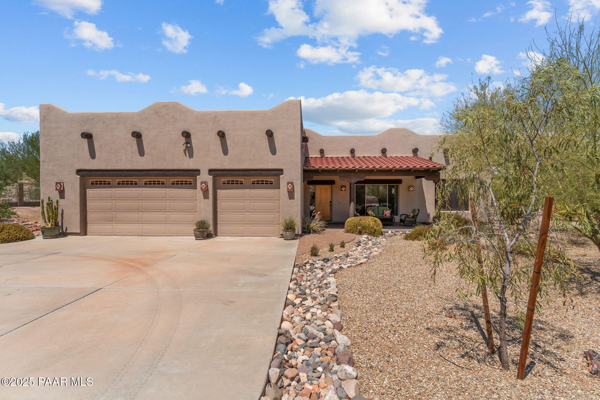 2100 West Silverlode Drive Wickenburg, AZ 85390 - Photo 1 of 51 a front view of a house with a yard and garage