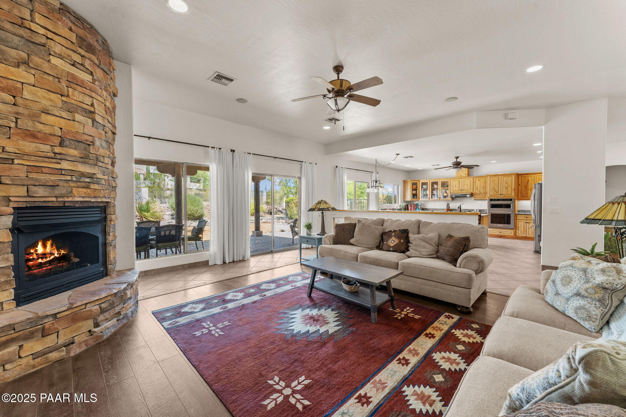 2100 West Silverlode Drive Wickenburg, AZ 85390 - Photo 11 of 51 a living room with furniture and a fireplace