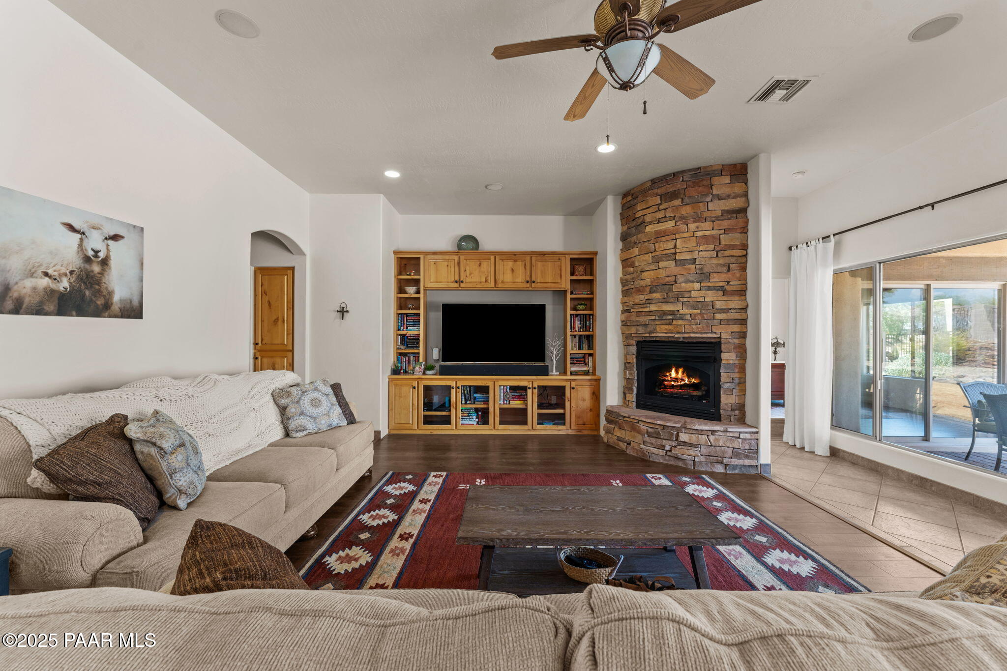 2100 West Silverlode Drive Wickenburg, AZ 85390 - Photo 13 of 51 a living room with furniture and a fireplace