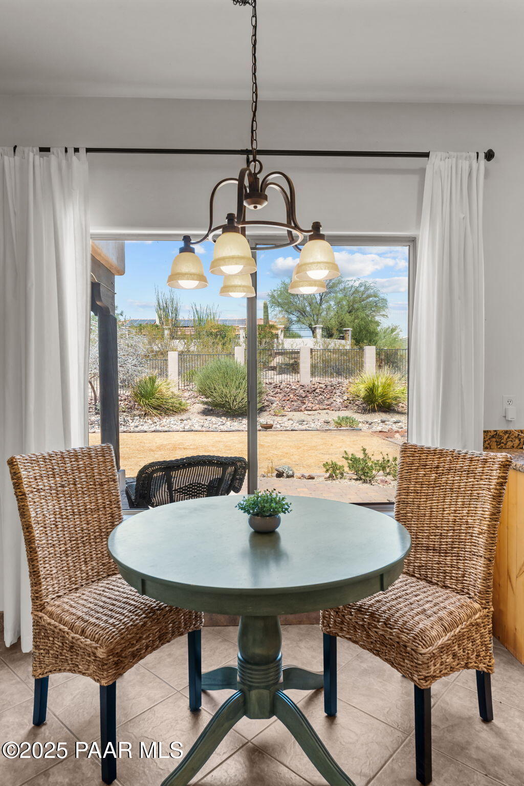 2100 West Silverlode Drive Wickenburg, AZ 85390 - Photo 16 of 51 a view of a dining room with furniture window and outside view
