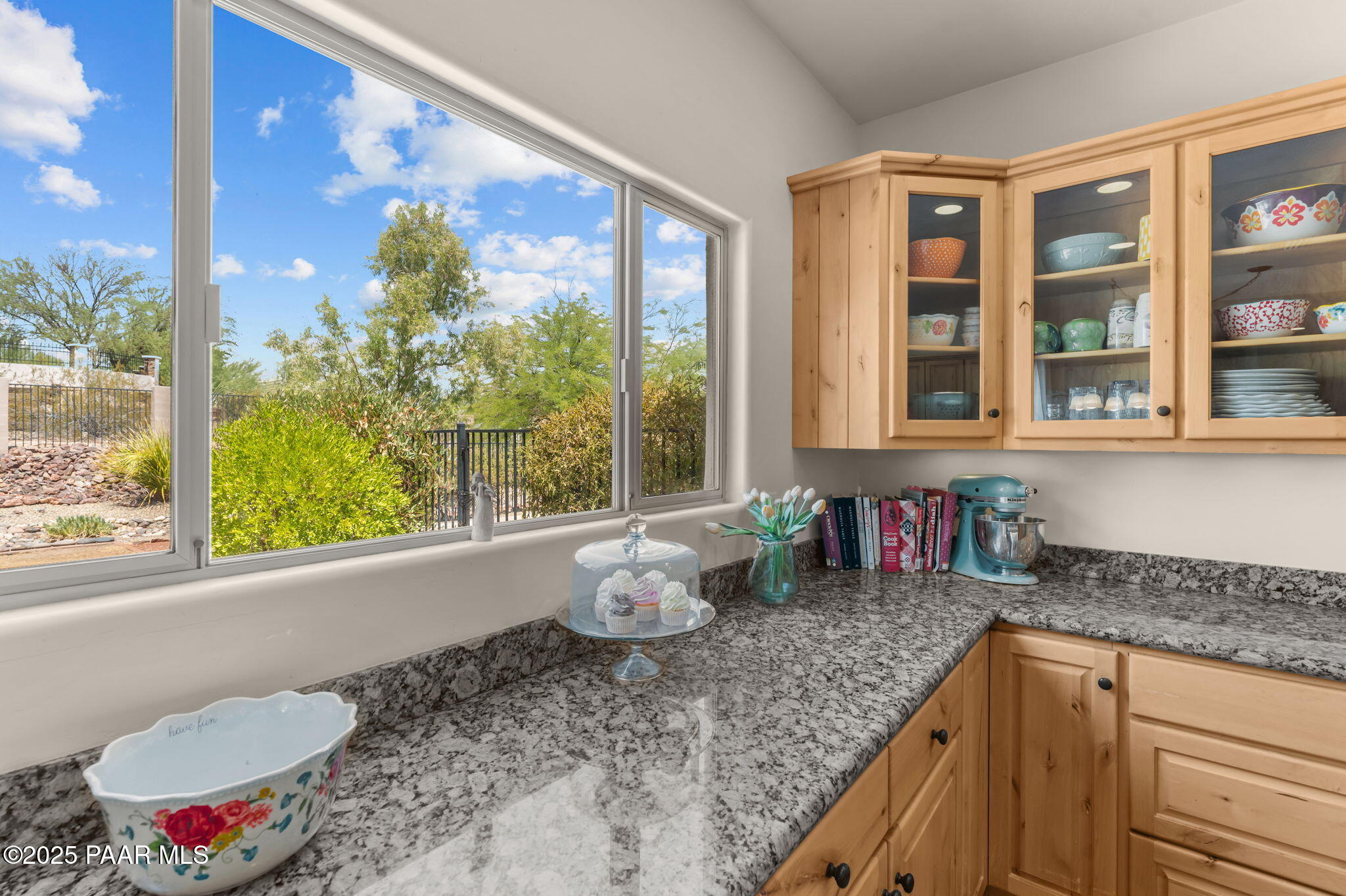2100 West Silverlode Drive Wickenburg, AZ 85390 - Photo 20 of 51 a kitchen with a granite countertop sink and large window
