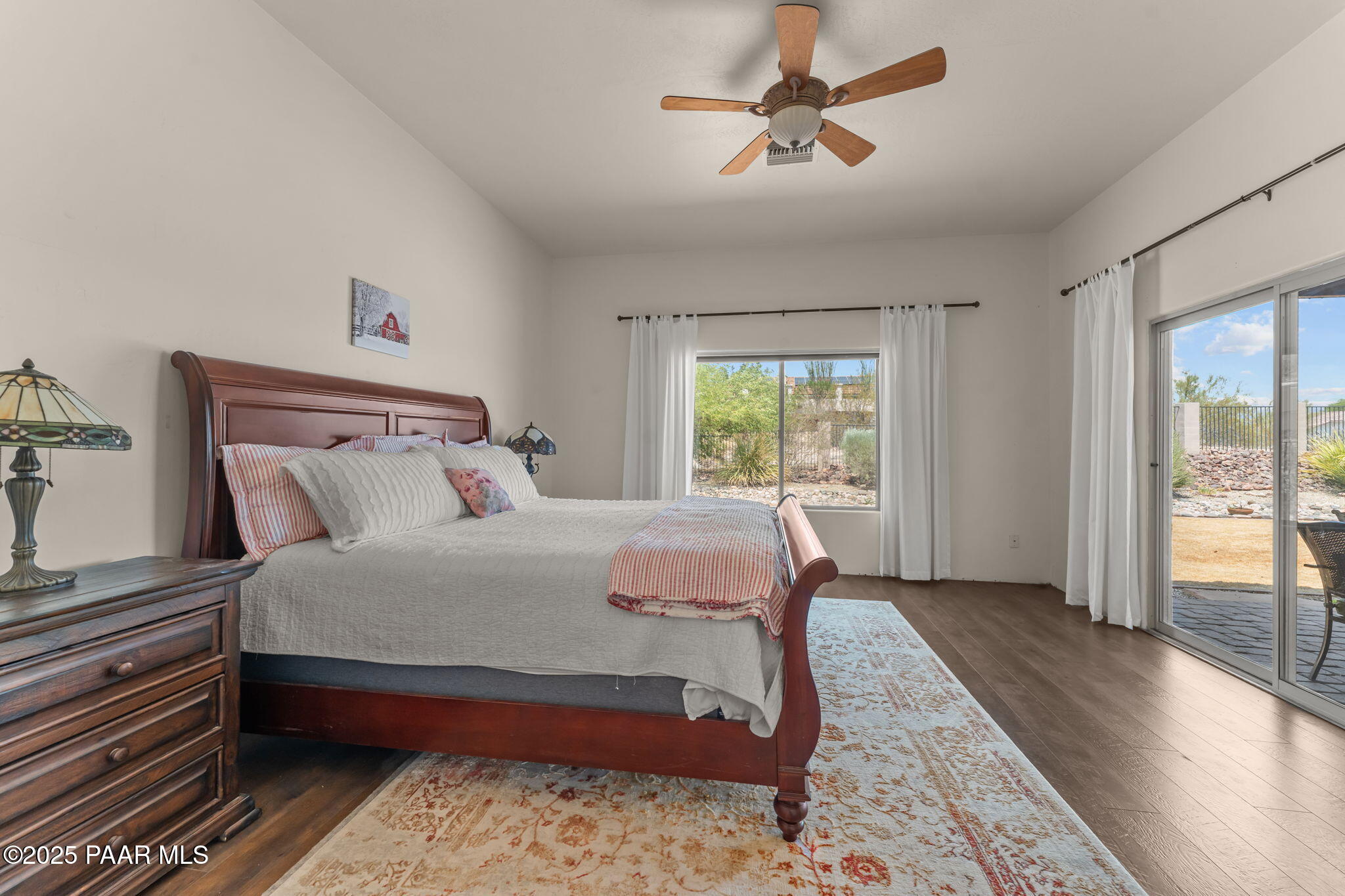 2100 West Silverlode Drive Wickenburg, AZ 85390 - Photo 23 of 51 a bedroom with a large bed and a window