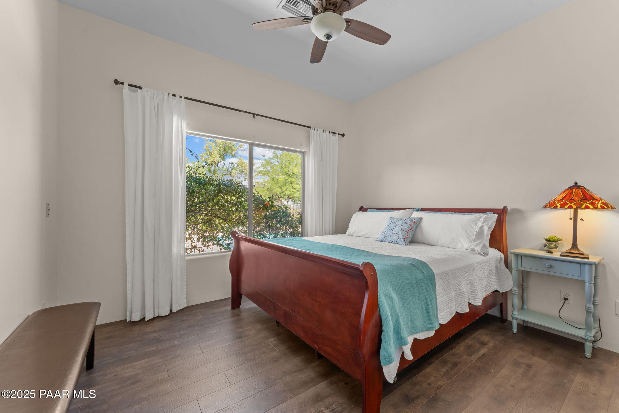2100 West Silverlode Drive Wickenburg, AZ 85390 - Photo 29 of 51 a bed sitting in a bedroom next to a window