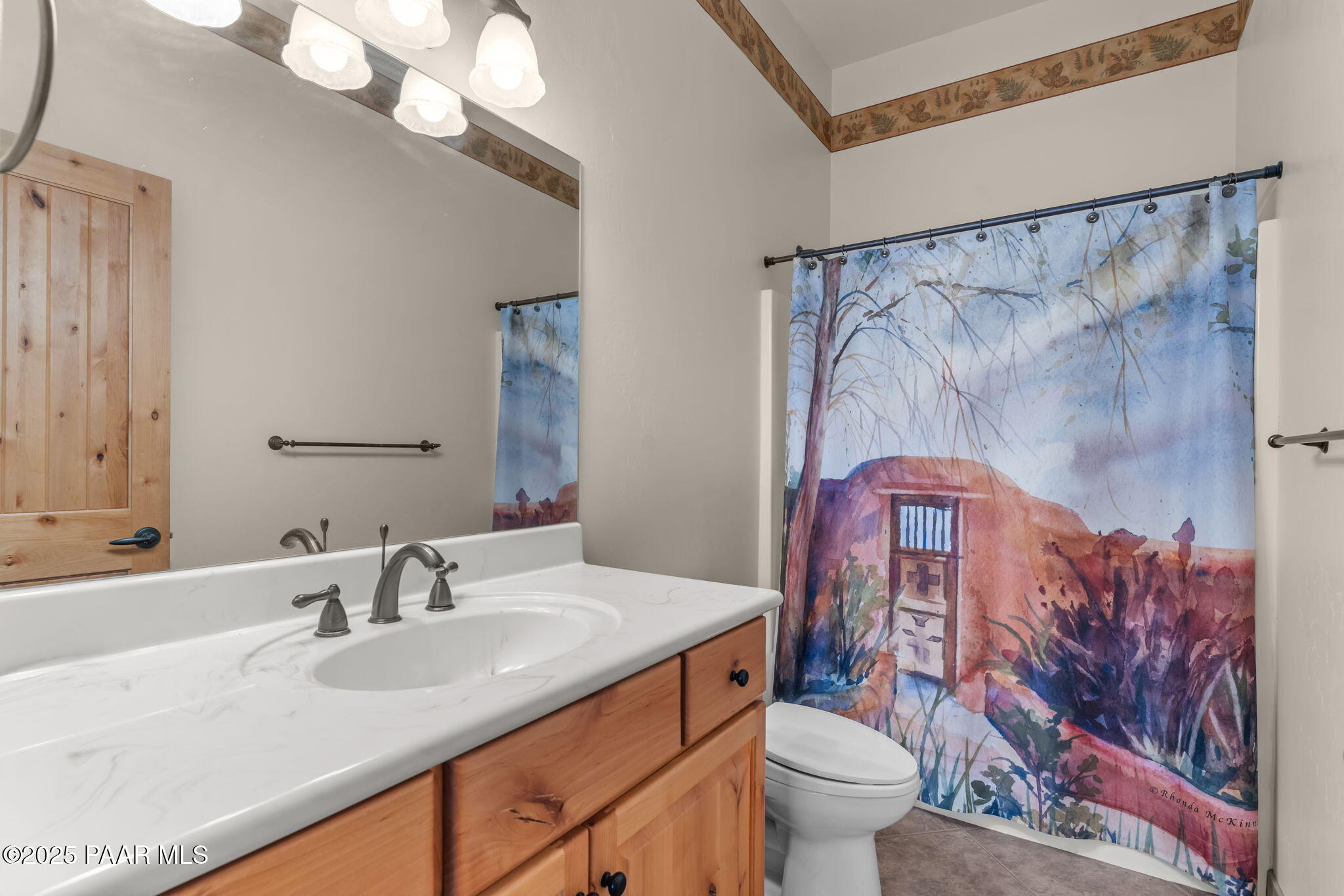 2100 West Silverlode Drive Wickenburg, AZ 85390 - Photo 32 of 51 a bathroom with a granite countertop sink a toilet and a mirror