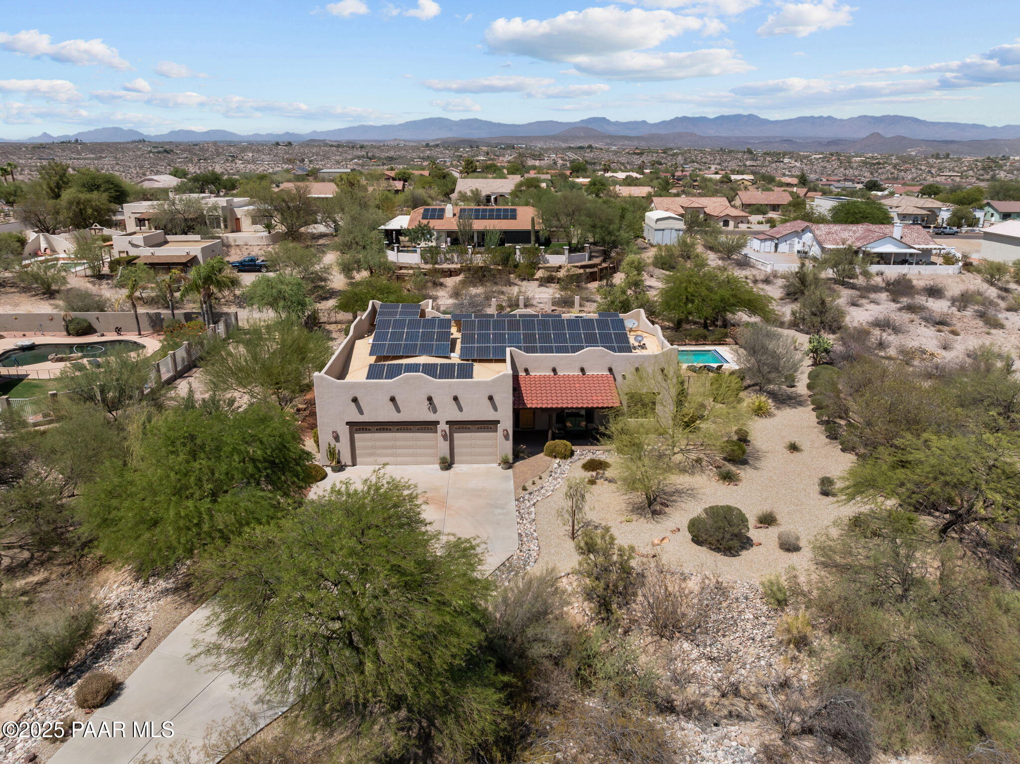 2100 West Silverlode Drive Wickenburg, AZ 85390 - Photo 48 of 51 an aerial view of a house with lots of trees