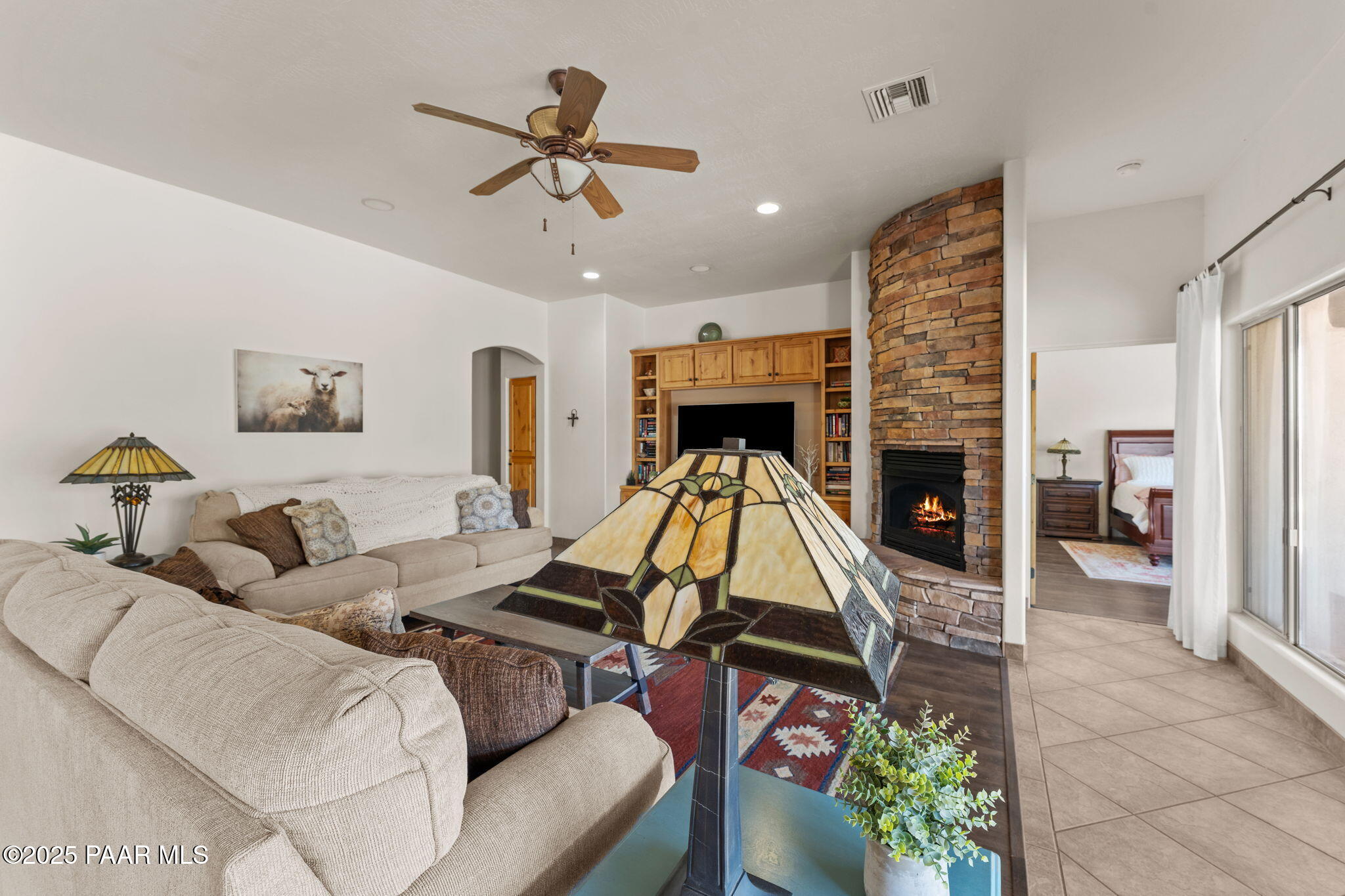 2100 West Silverlode Drive Wickenburg, AZ 85390 - Photo 9 of 51 a living room with furniture and a fireplace