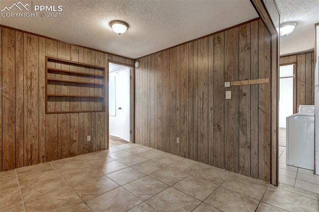 5274 South Yoder Road Yoder, CO 80864 - Photo 7 of 42 BONUS AREA-COULD BE USED AS FORMAL DINING- OFFICE-CRAFT AREA