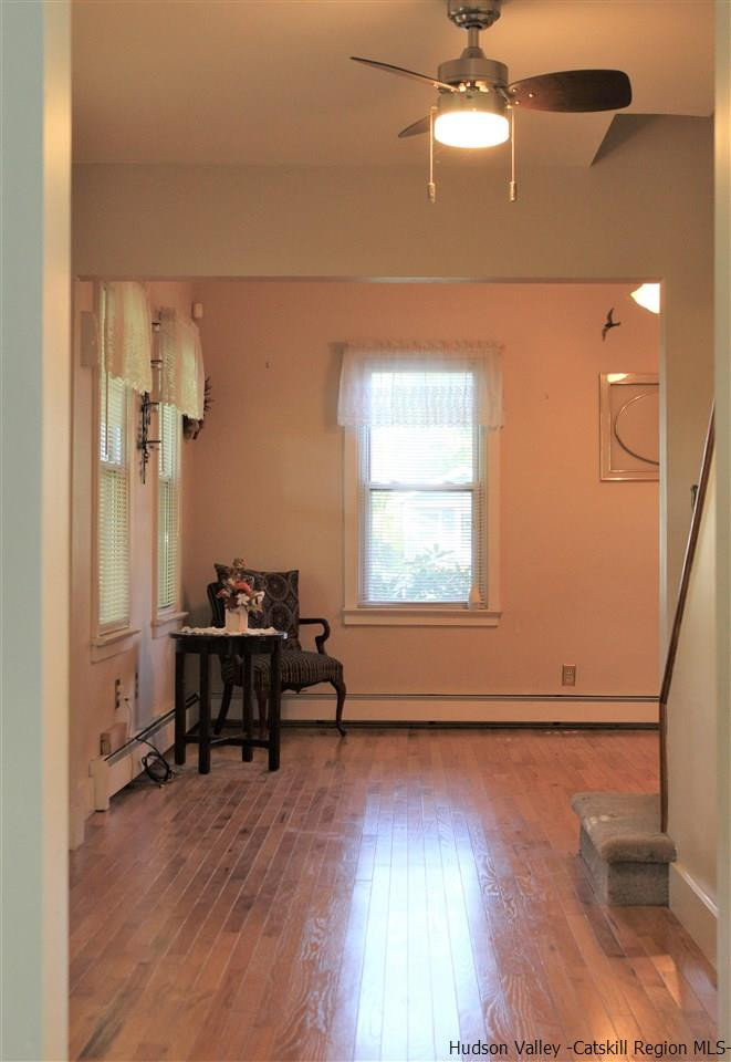 170 Samsonville Road Kerhonkson, NY 12446 - Photo 11 of 35 a view of a livingroom with furniture hardwood floor and a ceiling fan