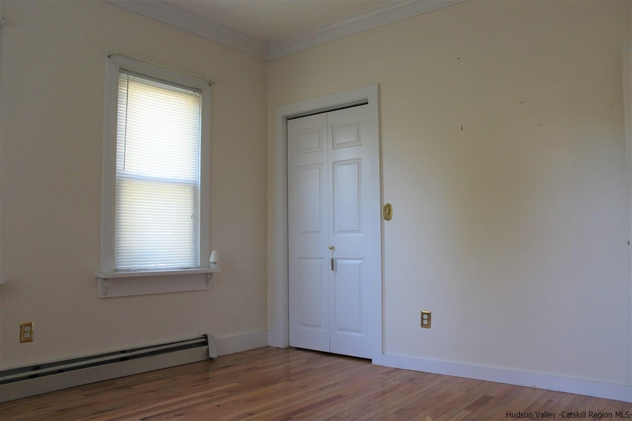 170 Samsonville Road Kerhonkson, NY 12446 - Photo 16 of 35 an empty room with wooden floor and windows