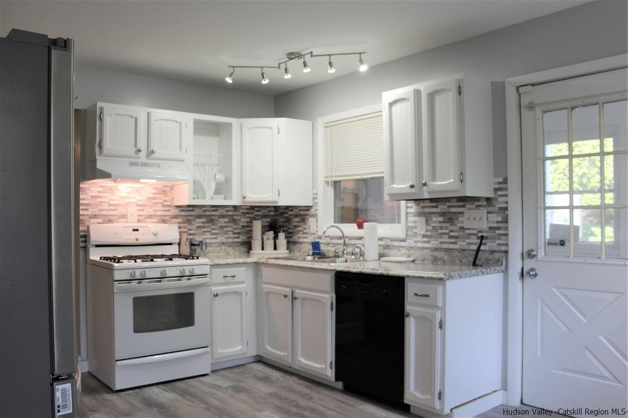 170 Samsonville Road Kerhonkson, NY 12446 - Photo 3 of 35 a kitchen with stainless steel appliances granite countertop a sink stove and cabinets