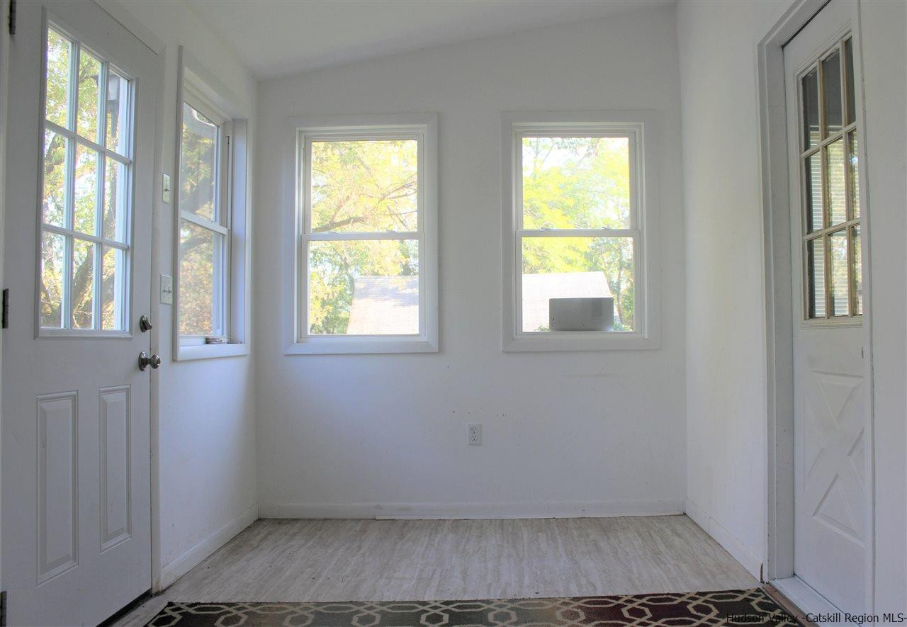 170 Samsonville Road Kerhonkson, NY 12446 - Photo 32 of 35 a view of an empty room with wooden floor and a window
