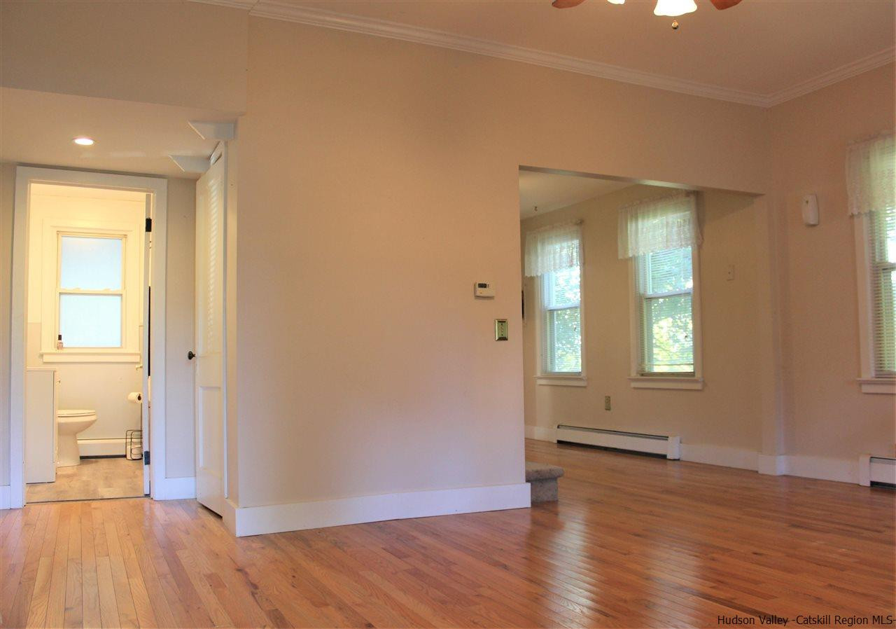 170 Samsonville Road Kerhonkson, NY 12446 - Photo 4 of 35 an empty room with wooden floor and a window
