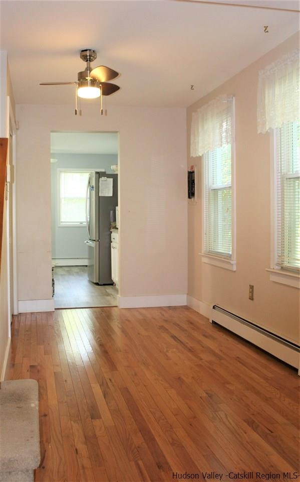 170 Samsonville Road Kerhonkson, NY 12446 - Photo 10 of 35 a view of an empty room with wooden floor and a window