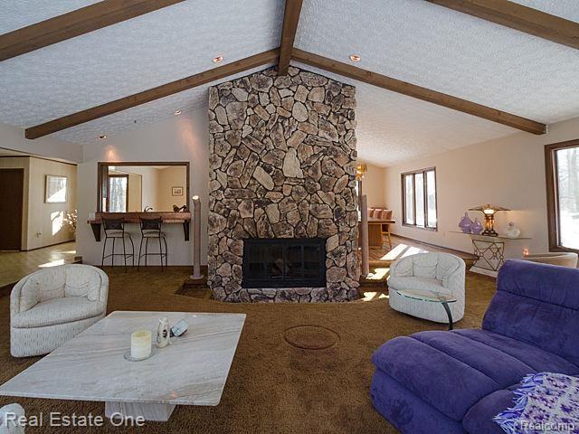 7555 Rattalee Lake Road Clarkston, MI 48348 - Photo 11 of 41 Warm up on the cold evenings with this natural fireplace!