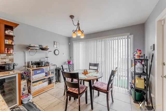 a view of a dining room with furniture and a window