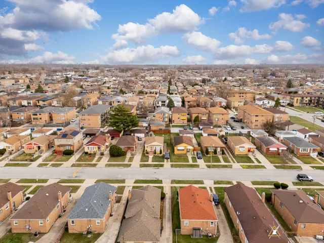an aerial view of residential building with parking space