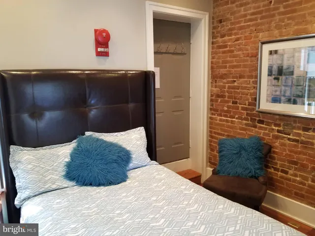 a bedroom with a bed and a cabinets