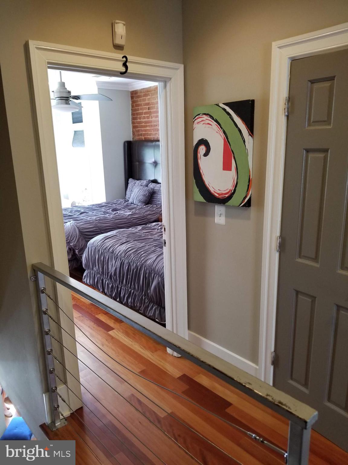 1203 U Street Northwest Washington, DC 20009 - Photo 24 of 40 a bedroom with a bed and a window