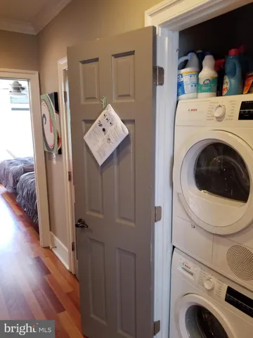 a view of a hallway with washer and dryer