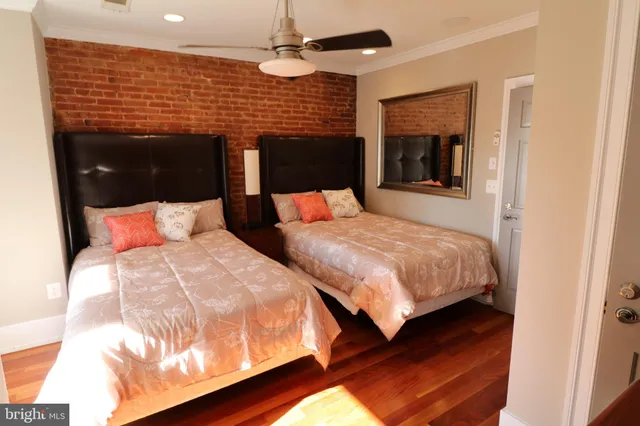 a bedroom with bed and a walk in closet