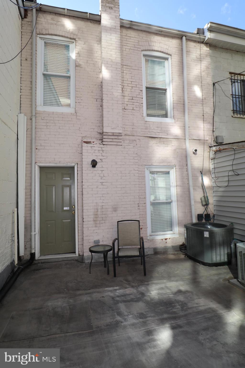 1203 U Street Northwest Washington, DC 20009 - Photo 39 of 40 a living room with furniture and a fireplace