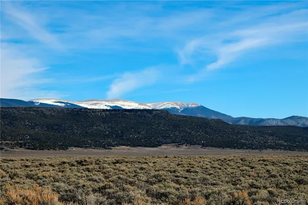a view of beach and mountain