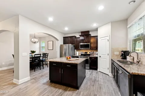 a kitchen with lots of counter top space and appliances