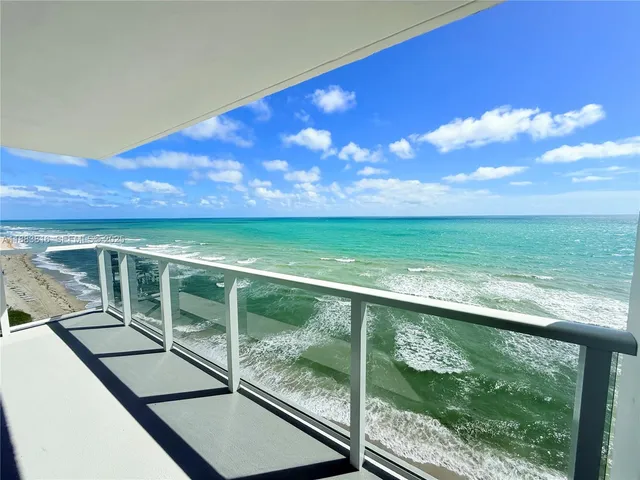 a view of an ocean from a balcony