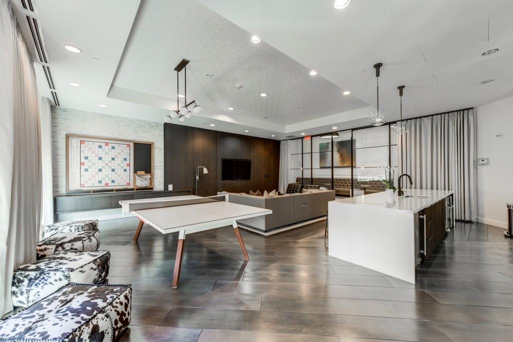 325 East Paces Ferry Road Northeast, Unit 1706 Atlanta, GA 30305 - Photo 16 of 22 a living room with lots of furniture and kitchen view
