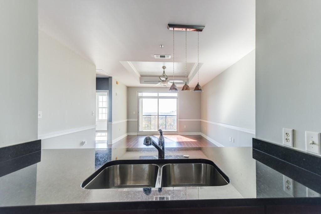 325 East Paces Ferry Road Northeast, Unit 1706 Atlanta, GA 30305 - Photo 7 of 22 a view of kitchen sink with granite countertop window