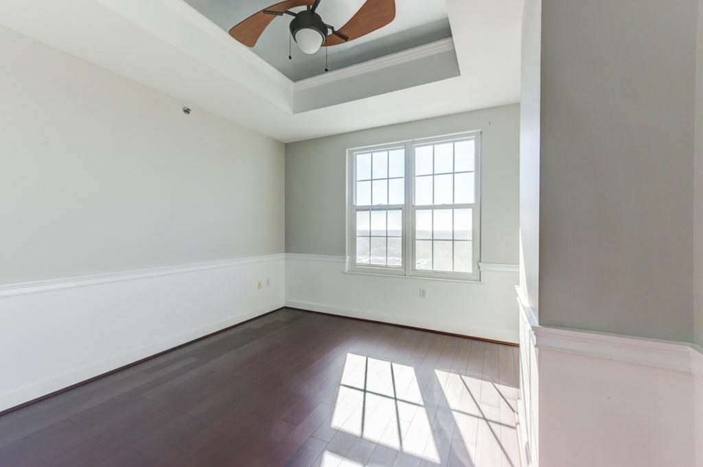 325 East Paces Ferry Road Northeast, Unit 1706 Atlanta, GA 30305 - Photo 10 of 22 an empty room with a window