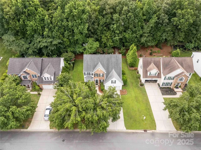 an aerial view of a house with a garden
