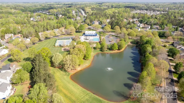 a view of residential houses with swimming pool