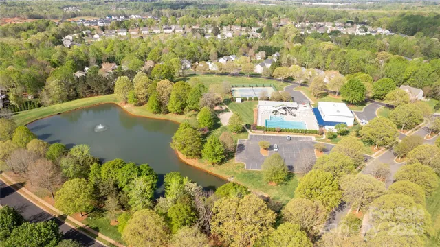 an aerial view of a residential houses with outdoor space