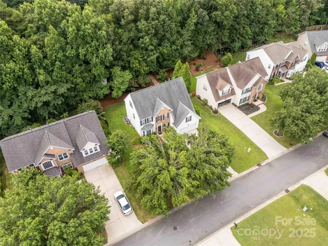 an aerial view of a house with outdoor space