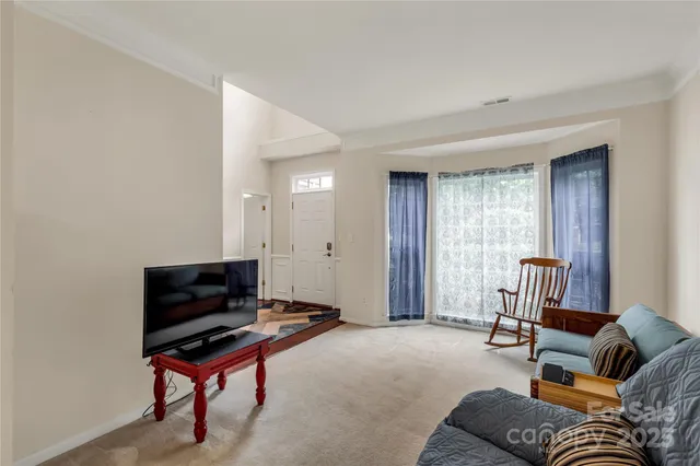 a livingroom with workspace and a couch
