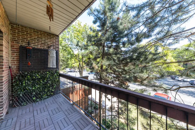 a view of balcony with wooden floor